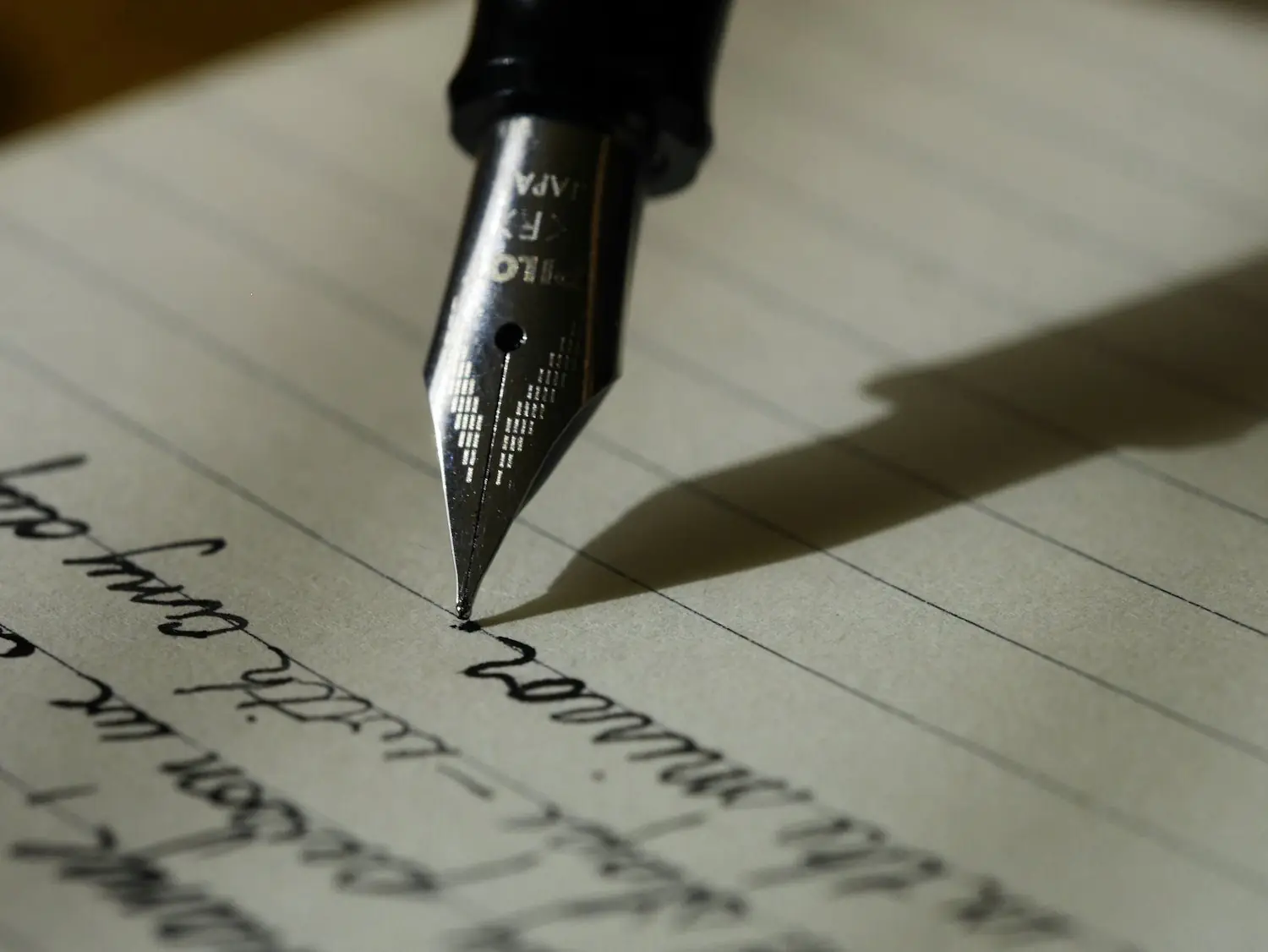 A fountain pen signing a document
